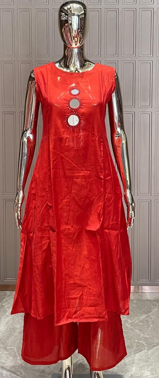 Red dress with embellishments on a mannequin against a gray background
